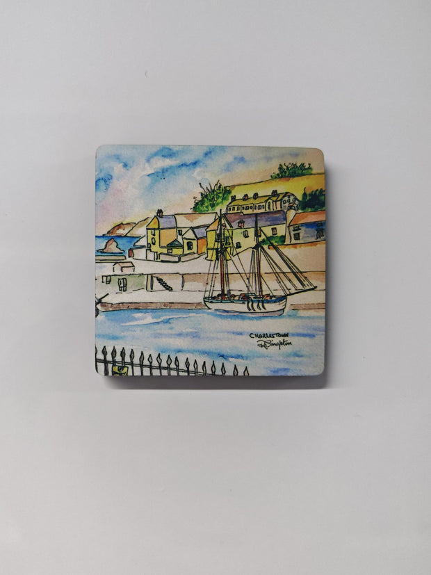 A square wooden magnet on a white metal background featuring the Charlestown watercolour print by R Singleton - reproduced with printing by HLSdesigner in Cornwall. Featuring the tall ship that frequents in the bay of Charlestown , views from the railings the opposite side of the bay - with the fishing village seen in the back ground, painted using colour washes and negative space. 