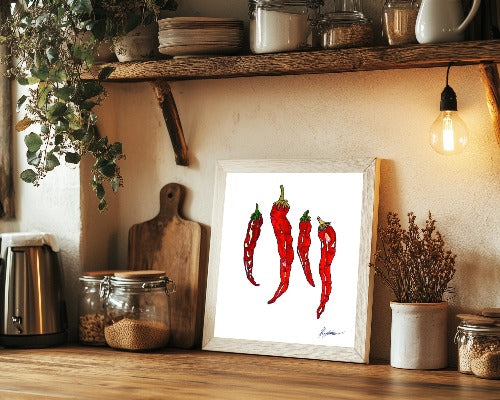 illustration of red hot chillies displayed in a beechwood frame surrounded with kitchen essentials lay upon the kitchen worktop next to the chopping board in dimmed warm lighting inspired by chef vegetable prep and food artwork