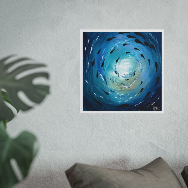 Abstract blue artwork of a fish shoal swimming through a blue vortex of ocean with light reflecting down from the ocean surface by hlsdesigner art prints on a wall with a plant and pillow in the foreground
