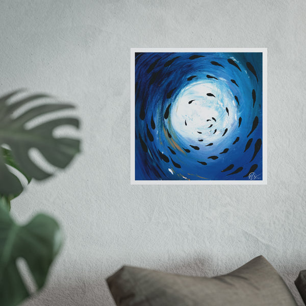 Unframed abstract artwork of a blue spiral with black fish shoaling through the ocean displayed on a white wall with a plant and pillow in the foreground. HLSdesigner