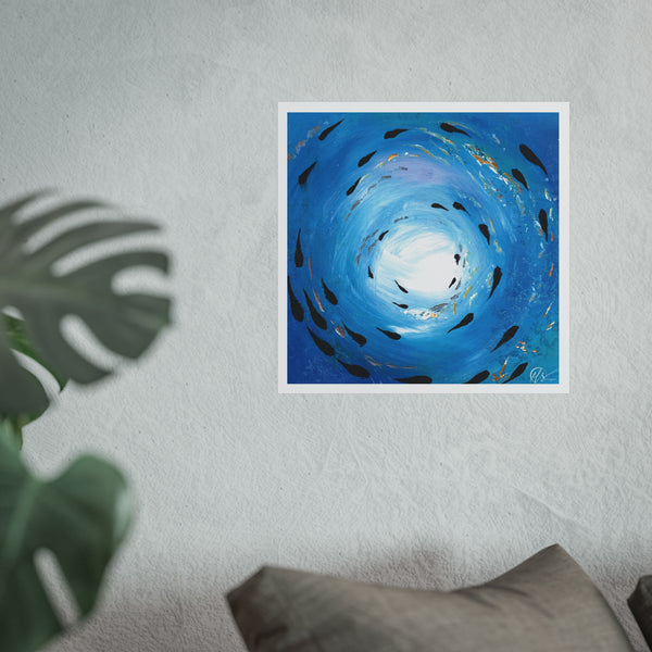 Unframed artwork of a blue spiral with black fish shapes shoaling around the painting with gold accents and white light shining through the ocean surface by hlsdesigner displayed on a white wall.