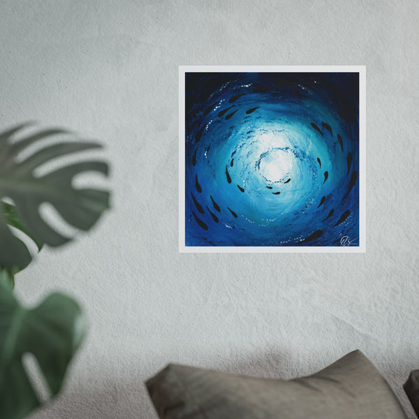 Unframed abstract artwork of a blue spiral with textured finishes through a shoal of fish swimming under the waters ocean surface by HLSdesigner displayed on a white wall with a plant and pillow in the foreground.