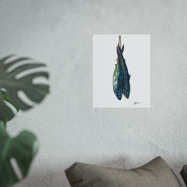 Framed artwork of a blue fish on a textured wall with a plant and pillow in the foreground. mackerel fish strung after freshly caught, food prep inspired seafood art