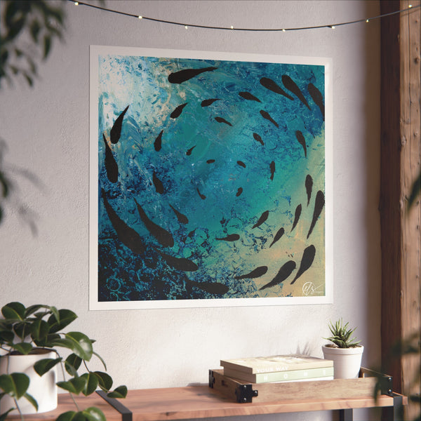 Unframed artwork of fish swimming in a blue ocean on a wall above a wooden console table. HLSdesigner
