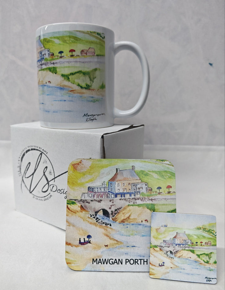 A white ceramic mug and matching coaster and magnet featuring a watercolour illustration of Mawgan Porth beach, displayed on a white box against a light Gray background. HLSdesigner has reproduced these prints on to accessories in tribute to the late R Singleton coastal Cornwall scene artist 