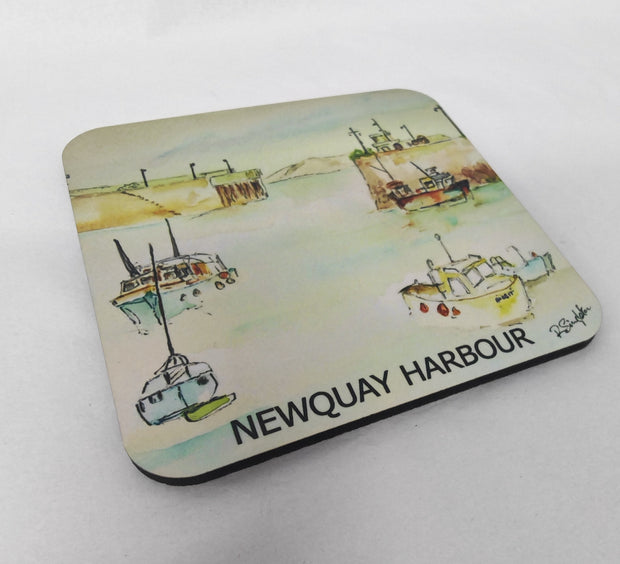 A square coaster with rounded corners featuring a watercolor painting of fishing boats in Newquay Harbour, with the text 'NEWQUAY HARBOUR' printed along the bottom edge. Painted by R Singleton and printed exclusively by HLSdesigner