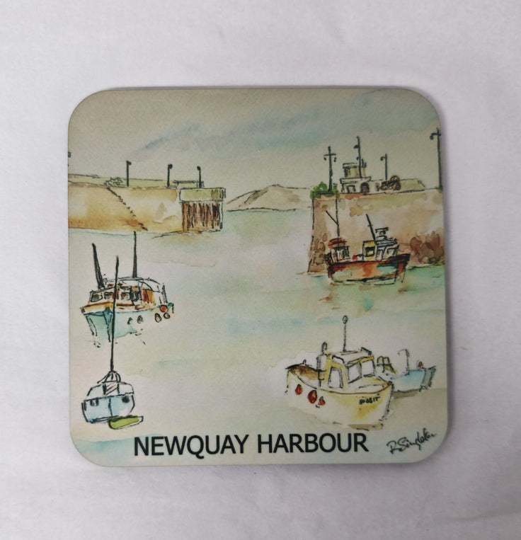 A square coaster with rounded corners featuring a watercolour painting printed of Newquay Harbour in Cornwall on a white background 