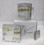 A Newquay Harbour themed gift set featuring a white ceramic mug, a square coaster, a small square wooden magnet to match and a branded HLSdesigner white box. The items are decorated with a watercolour painting of fishing boats on a harbour and the text 'Newquay Harbour' and 'Newquay Bay'.