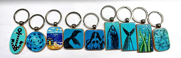 hand painted wooden keyrings with a clear coated top coat for protection, from seaweed to starfish and beach huts, choose your very own keyring, hand painted means made to order and customised to you, original and never the same
