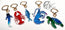 Set of colourful keychains shaped like a whale shark, lobster, fish, and turtle on a white background. Featuring drawn designs by HLSdesigner in Cornwall, Green sea turtle, blue king shrimp with pink detailing and spotted shading, blue watercolour inspired sardine with orange eye, red and orange spotted king lobster and a constellation inspired whale shark illustration with spots, linear work and stars. All printed into acrylic and finished with a gold metal clasp in the shape of a seashell.