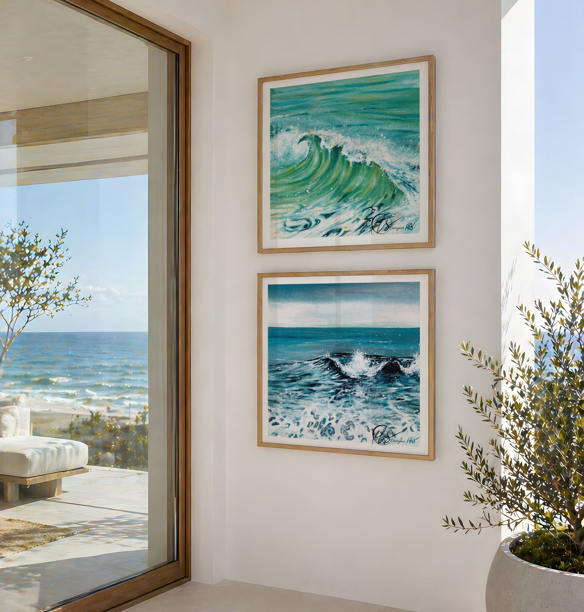Two framed ocean wave paintings hanging on a white wall in a modern interior setting with a glass door showing the sea outside. These prints are of Dusk Tide and AQUA - two beautifully represented waves crashing into the shoreline, both at different times of the day showing the coloured hues of the weather shining through the waves. Designed by HLSdesigner , Hannah Singleton, Cornwall based fine artist and illustrator. Image is not to scale and print sizes vary