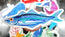 blue sardine illustrated die cut sticker made from vinyl for waterproof finish, raised above an array of other stickers blurred in the background