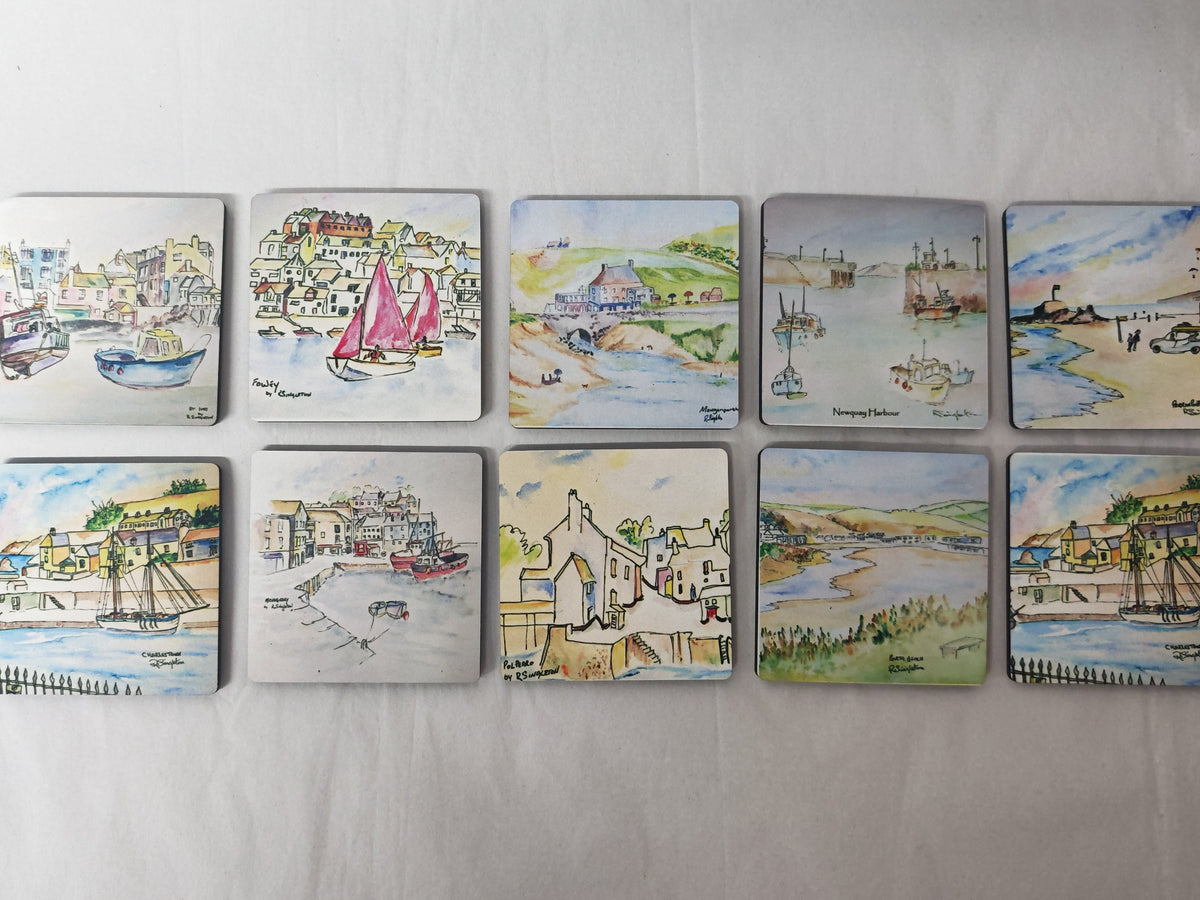 A set of 12 square magnets featuring hand-painted harbor and harbor-town illustrations, arranged in two rows of six on a light gray fabric background.watercolour paintings of cornwall by R SINGLETON reproduced by HLsdesigner 