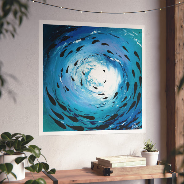 Unframed artwork of a blue spiral with black fish-like shapes on a white wall. under the ocean wave art print depicting light reflecting through the ocean surface and a shoal of fish playing below 