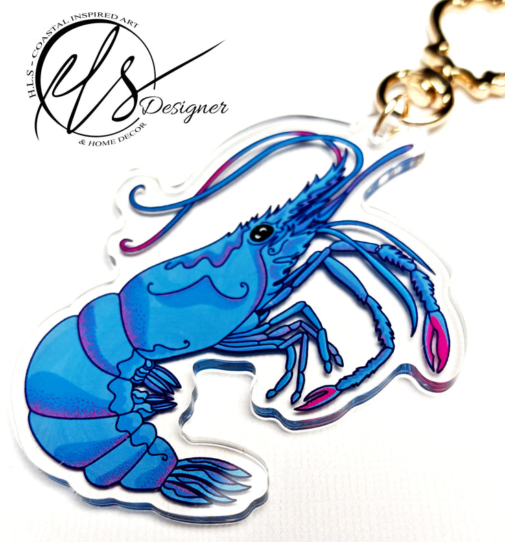 blue king shrimp close up photography image of a shrimp illustrated and printed onto an acrylic keychain with a seashell shaped clap in gold metal. perfect for decorating keys and accessories. HLSdesigner coastal inspired art and home décor 