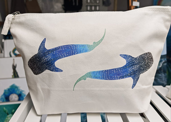 large 5 litre whale shark cosmetic bag, off white cotton canvas accessory bag with metal zip,  with ocean themed artwork in the background. whale shark illustration fading from blue to green with white spots pressed onto the bag
