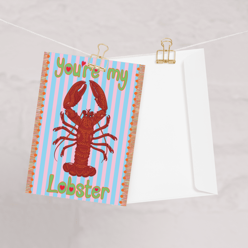 you're my lobster greetings card featuring HLSdesigner illustrations on a red and orange lobster with adorable loving eyes, green bubble text with heart centres and a blue and pale pink striped background with an orange tassel effect on each side, ocean inspired pun greetings cards designed and made by HLSdesigner