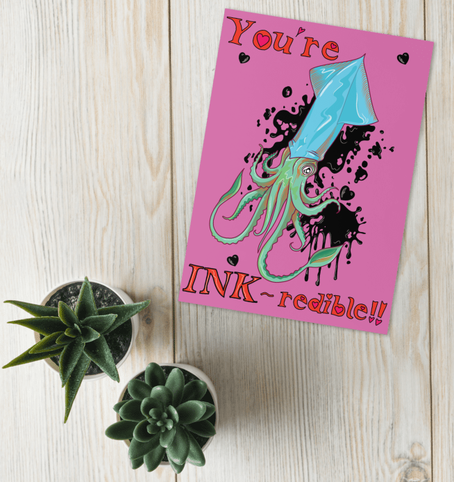 ocean pun greetings card in vivid pink with a blue and green squid with black ink forming hearts around and hand written bubble writing which reads 'you're INK-redible' designed and made by HLSdesigner