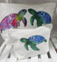 showing the large and the small accessory bag sizes, these showcase the pink and green turtles facing each other and the small bag has a single green turtle illustration pressed onto it 