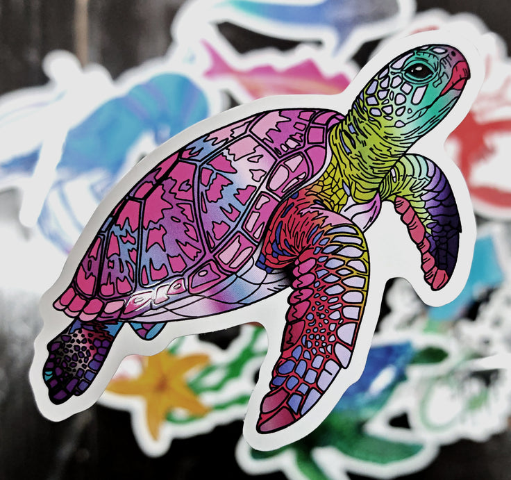 pink sea turtle die cut sticker illustration raised above a variety of other stickers on a black background