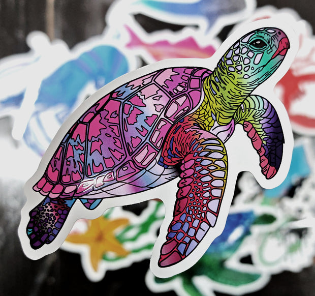 pink sea turtle die cut sticker illustration raised above a variety of other stickers on a black background