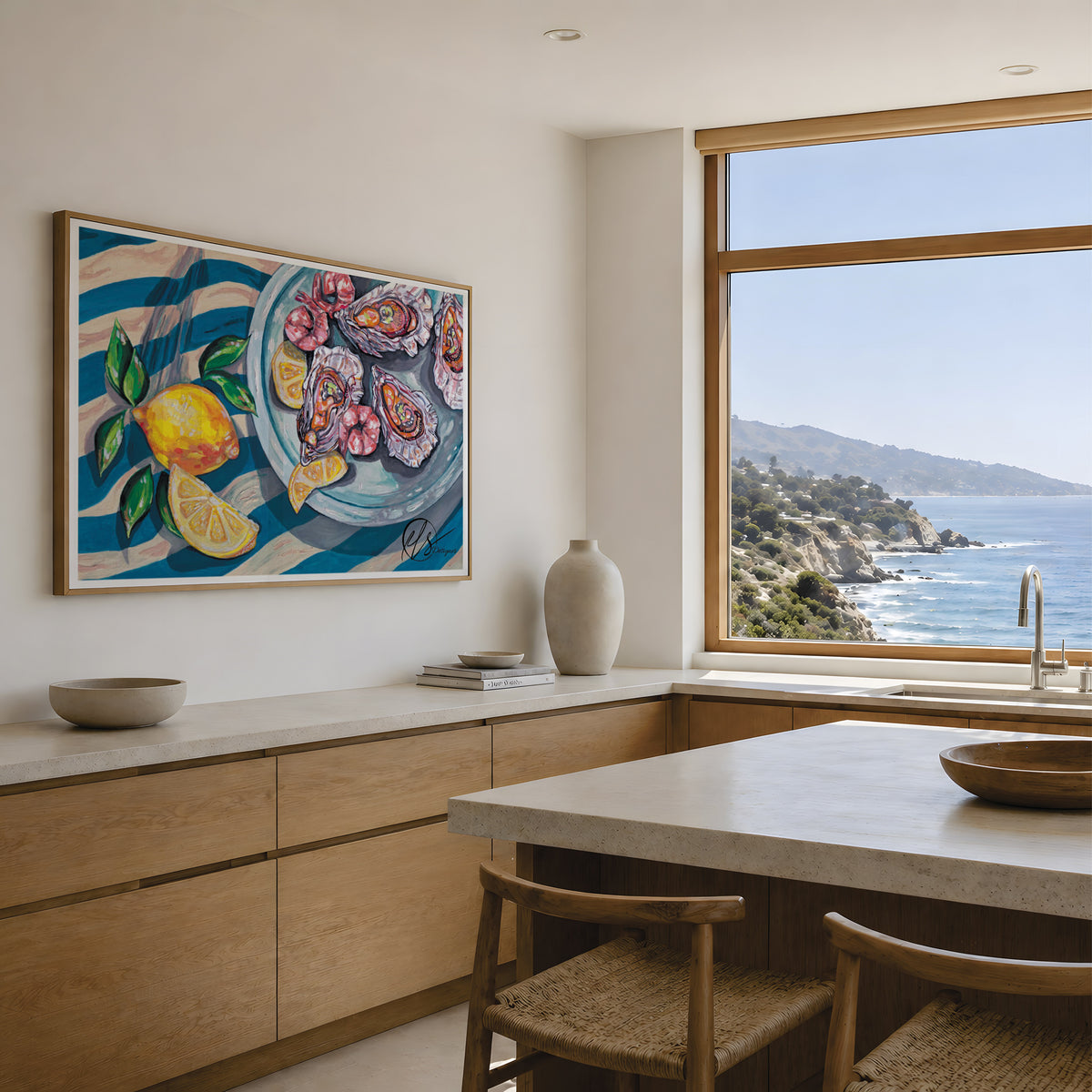 A framed, colourful print inspired by Mediterranean seafood dishes features a tray of oysters freshly shucked with lemon slices and a whole lemon on blue striped linens. This painting is Tesoro del Mar - a seafood inspired dish created by HLSdesigner. Displayed in a clean wooden and marble looking kitchen with sea views, print sizes are not to scale in this photo. Designed by Hannah Singleton, coastal Cornish based artist.