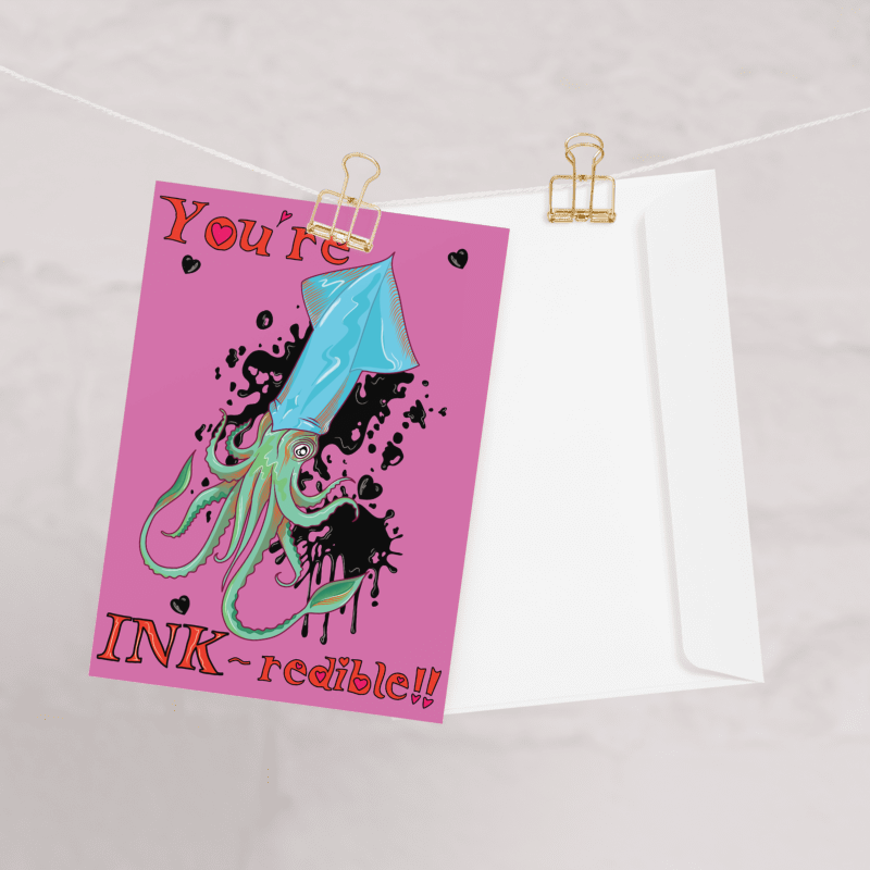 ocean pun greetings card in vivid pink with a blue and green squid with black ink forming hearts around and hand written bubble writing which reads 'you're INK-redible' designed and made by HLSdesigner